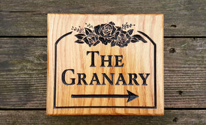 Square House Sign the grannary with an arrow and rose scroll FONT: LATIENNE