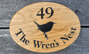 280x200mm Oval Number House Sign with 49 The Wrens Nest and Wren engraved onto the sign.