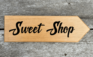 Sweet Shop Sign pointing towards the right