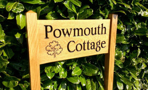 medium ladder sign engraved with powmouth cottage and an ouk tree